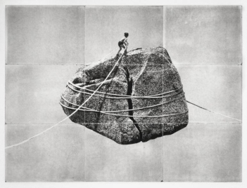 Boy hiking a giant floating rock.