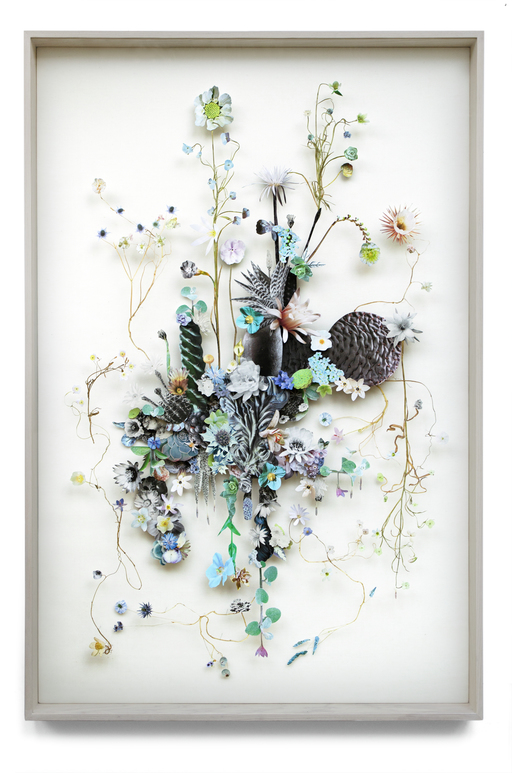 Still life photo of a framed 3D collage artworks of flowers.