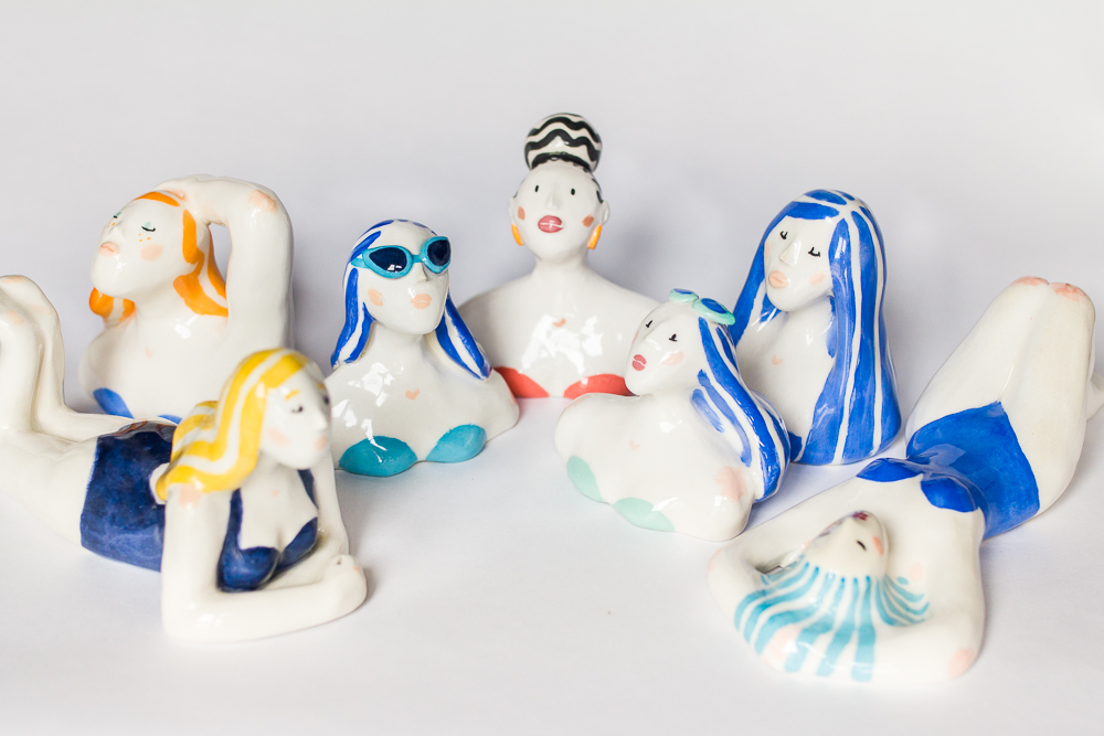 Still life photo of a group of female ceramic swimmers.