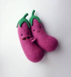 Still life of two eggplants made of felt.