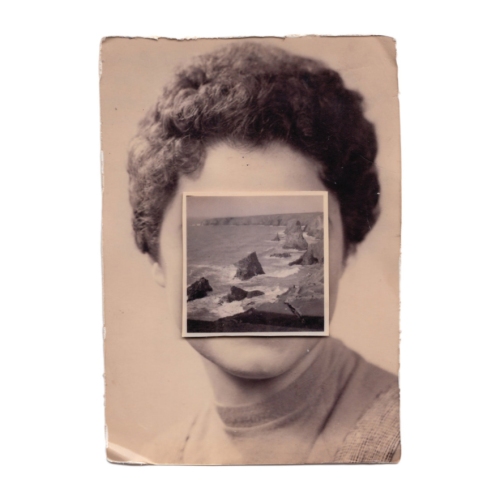 Vintage woman portrait with the face covered by a vintage seascape photo.