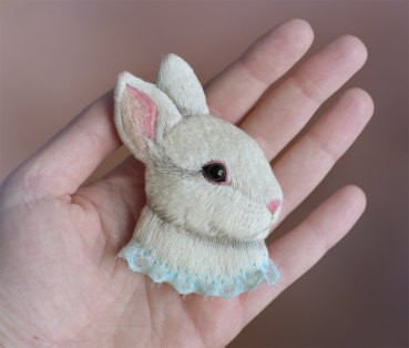 Still life of a rabbit brooch.