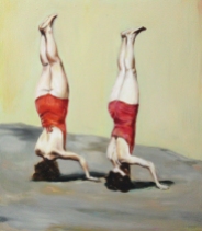 Full body portrait of two women in red bathing suit seen from their back and upside down.