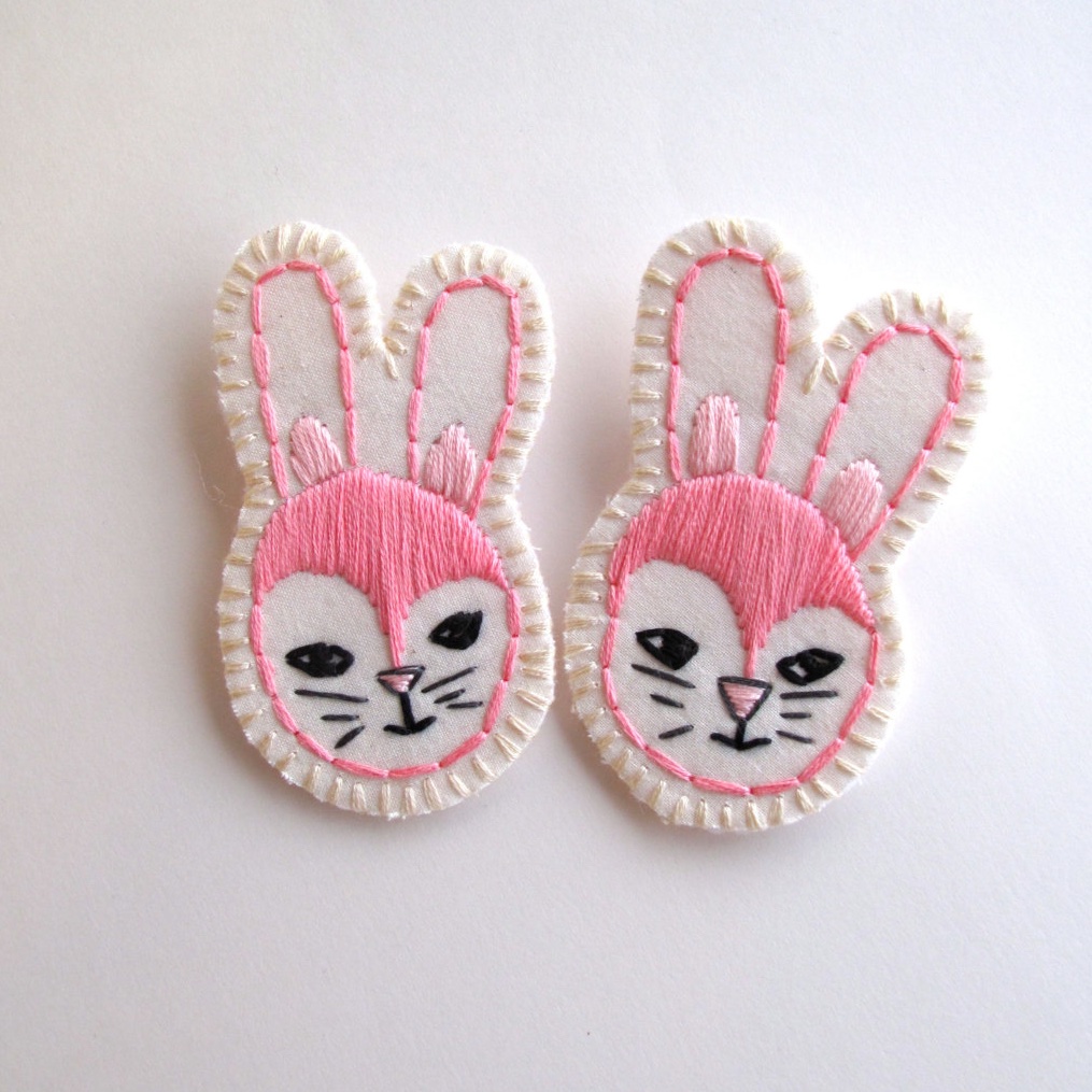 couple of embroidered bunny brooches.