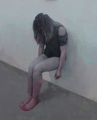 Woman laying down a wall.