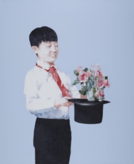 Portrait of a young boy holding a hat and a flower bouquet.