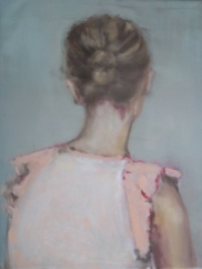 Female portrait seen from her back wearing a beige blouse.