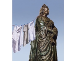 Monument of queen Victoria painting with clothes hanging aside her.
