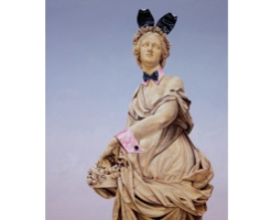 Female monument painting wearing bunny ears.